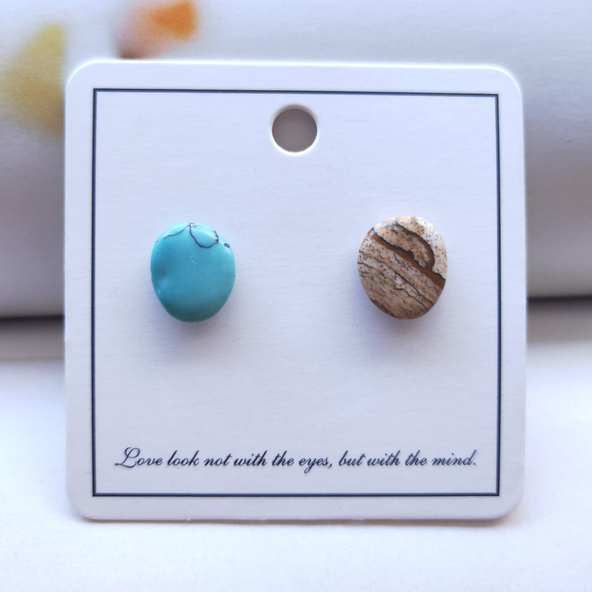 Turquoise and wooden stud earrings on a card with text.
